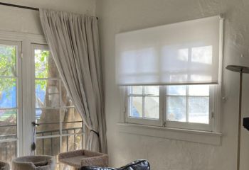 Custom sheer roller shades installed in a Studio City living space, showcasing elegant pull down window shades.