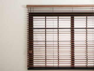 Faux wood blinds in Studio City living room, creating a warm and inviting ambiance.