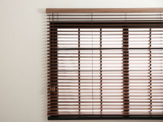 Faux Wooden Blinds | Studio City Blinds & Shades CA Faux wood blinds in Studio City living room, creating a warm and inviting ambiance.